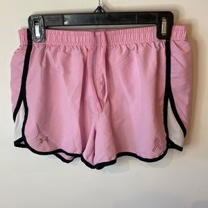 Pink women’s under Armour athletic shorts, size medium